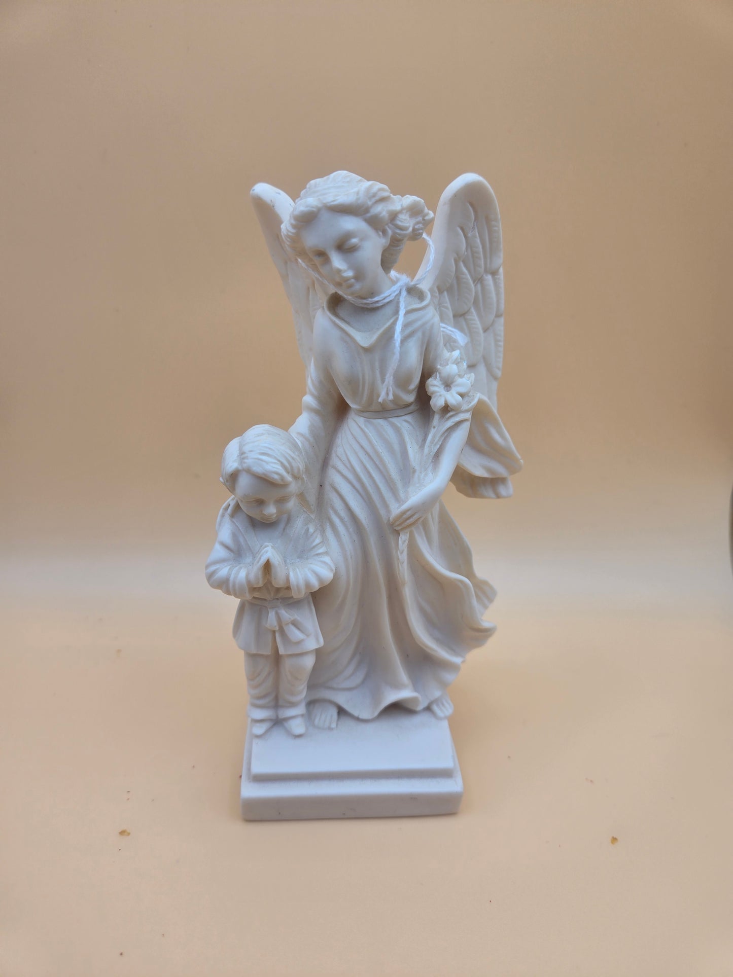 Boy with agel watching over him